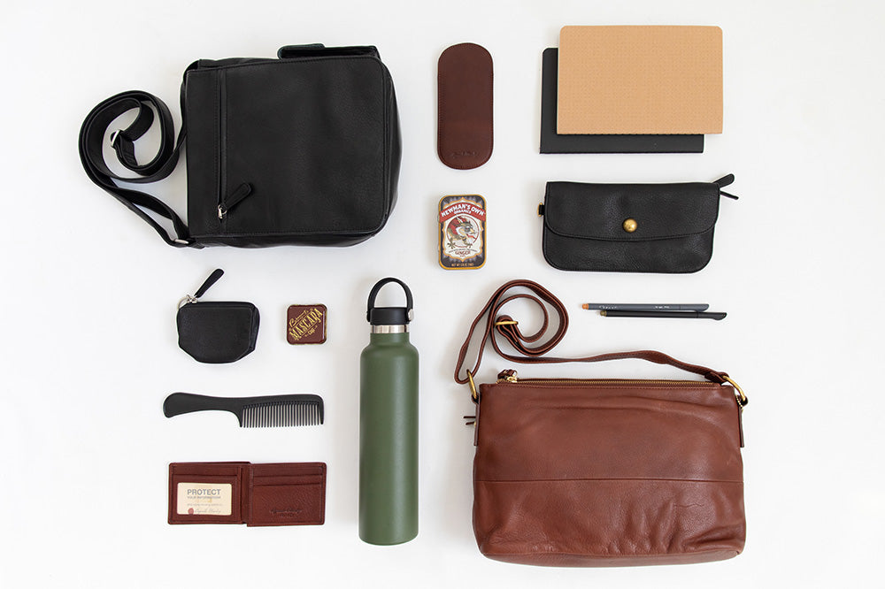flat lay of messenger bag and it's contents