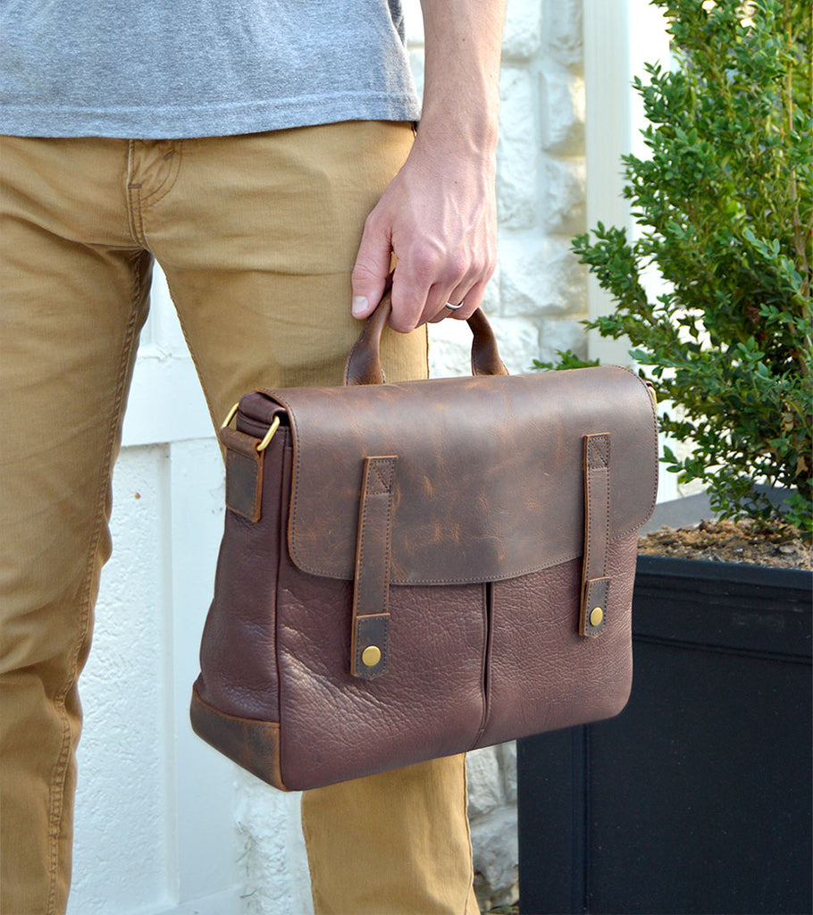 Image of man holding the Osgoode Marley Edmund bag.