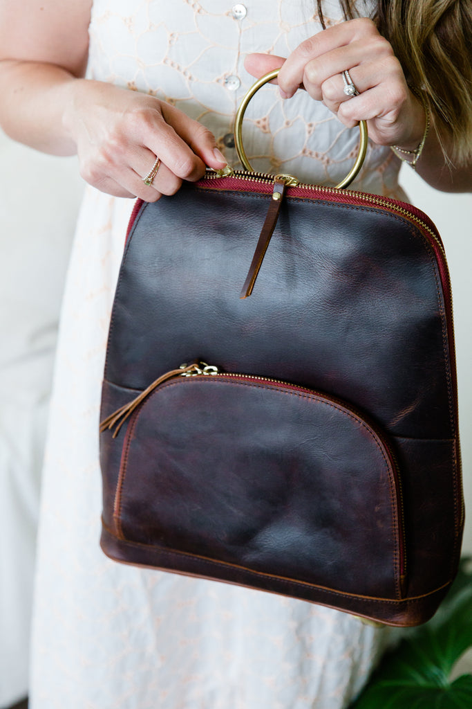 Hands of a model with a Blaire Backpack